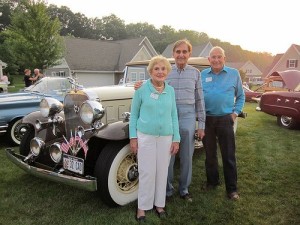 Residents enjoying the annual antique car show
