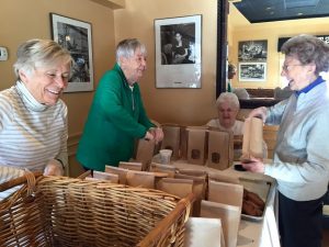 Highlands residents pack up baked treats for patrons of the annual bake sale to take home for the Thanksgiving holiday