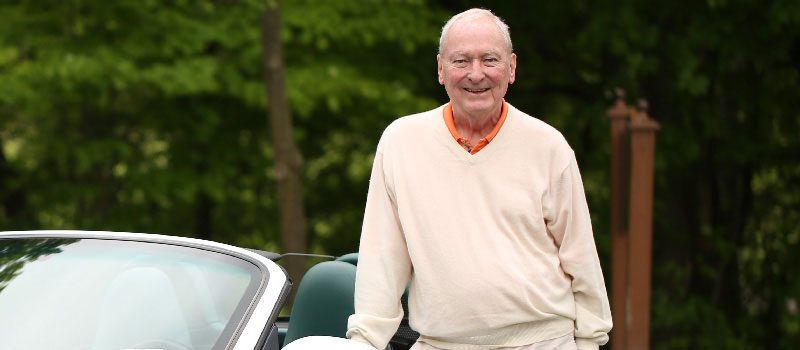 Man standing next to his car