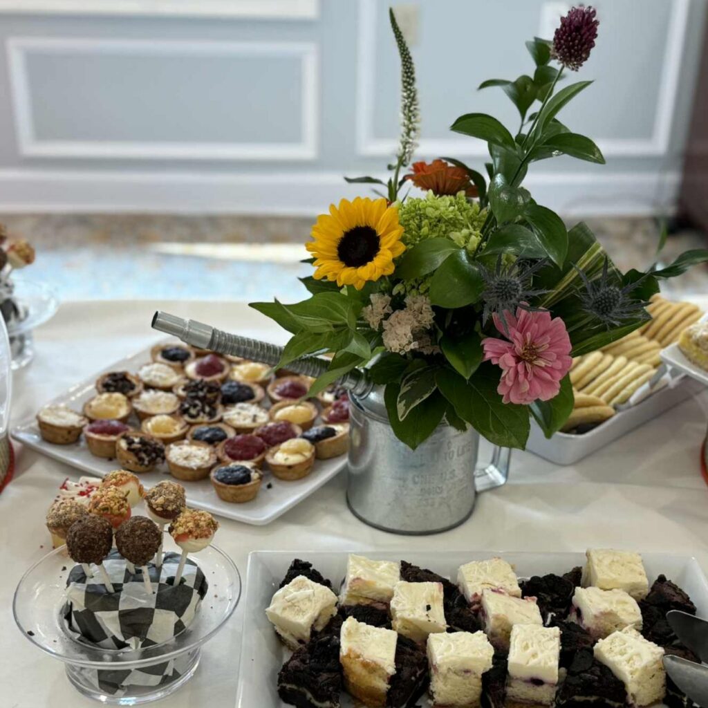 The-Highlands-At-Pittsford-Culinary Flowers and treats table at an event
